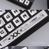 Close-up view of a set of transparent pudding style PBT keycaps for a CSGO gaming keyboard.
