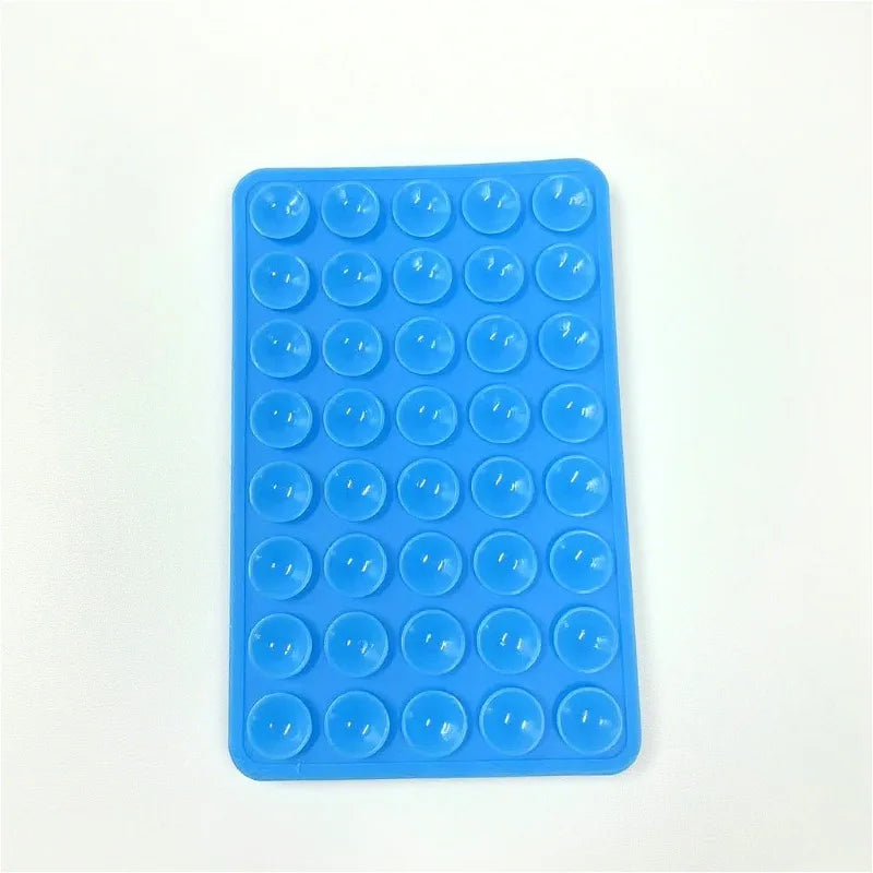 A blue silicone phone mount grip with multiple circular holes for mounting devices.