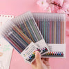 A hand holds a clear plastic case of glitter gel pens with various colors and tips, displayed against a pink background.