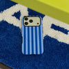 A blue striped phone case for an iPhone resting on a blue and white textured surface.