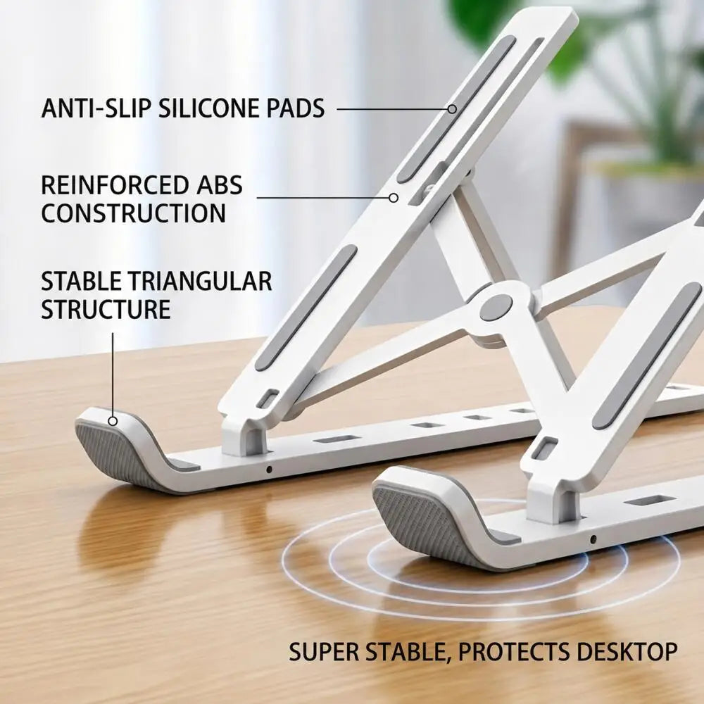 A white adjustable foldable laptop cooling stand featuring anti-slip silicone pads and a stable triangular structure on a woo