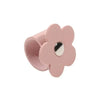 A pink leather flower cable organizer used as a reusable cord winder.