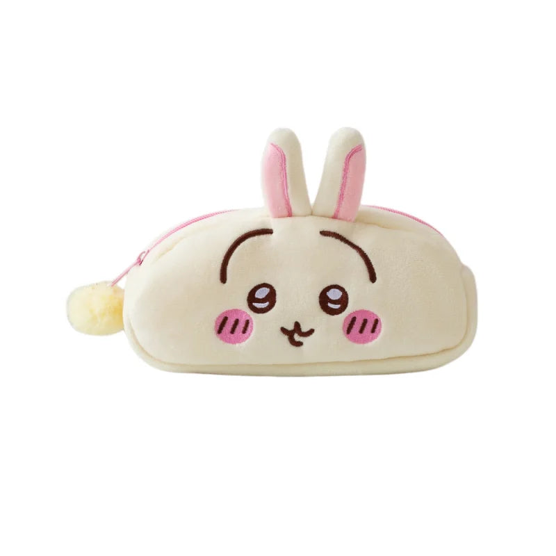 A cute, light beige Chiikawa plush pencil case with pink ears and embroidered facial features.