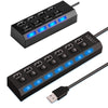 A black USB hub splitter extender with seven ports and blue indicator lights, shown from above and in use.