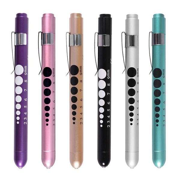 A set of six professional medical penlight torches in various colors including purple, pink, beige, black, silver, and teal.