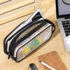 A transparent mesh pencil pouch with various school supplies is shown on a wooden surface.