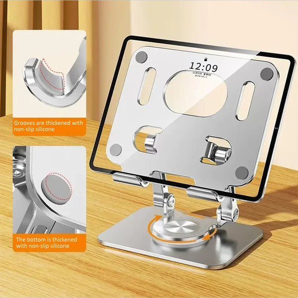 A silver tablet stand with a rotating base and non-slip silicone grooves for secure placement.