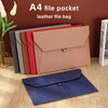 A collection of leather file bags and a navy blue folder are displayed on a wooden surface.