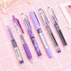 A set of purple and black precision rollerball gel pens displayed on a pink grid background.