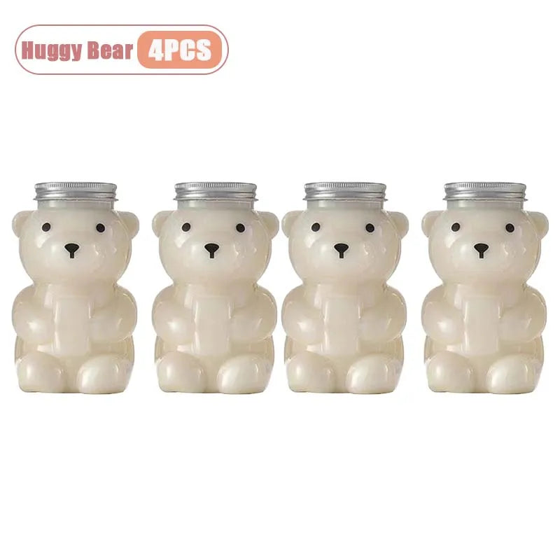 Four white bear-shaped reusable water bottles with silver lids.