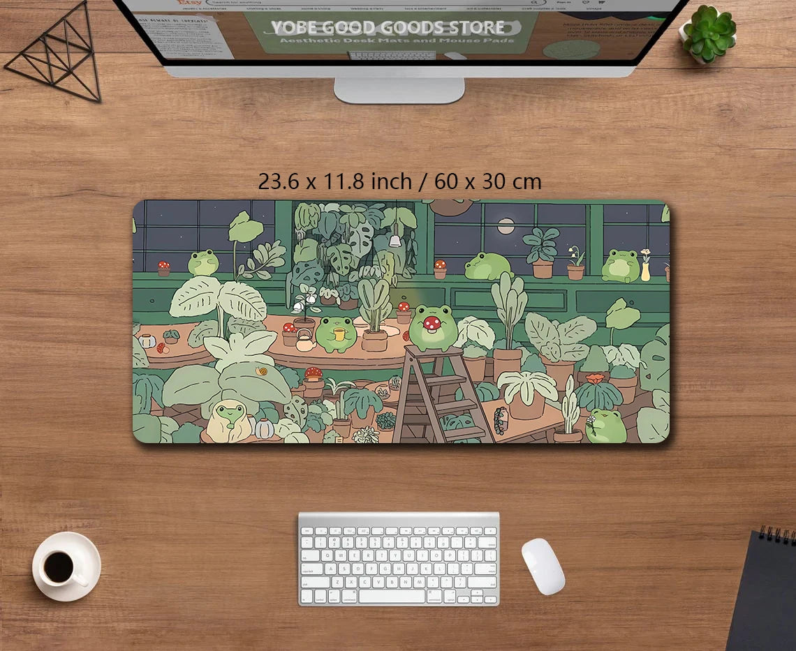 A large green frog desk mat featuring various potted plants and cute frogs for a gaming setup.