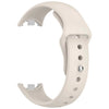 A white silicone replacement strap for a Mi Band watch, shown from the side.
