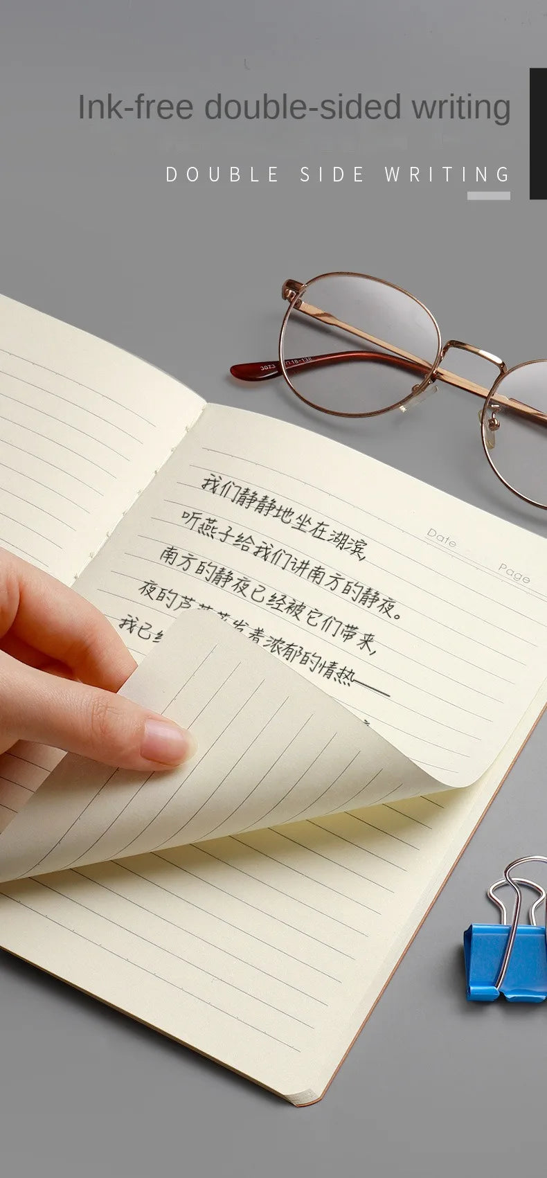 A close-up of an open notebook showing double-sided writing with a pen and eyeglasses on a gray background.