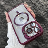 A hand holds a purple MagSafe-compatible phone case with a built-in camera bracket and lens cover.