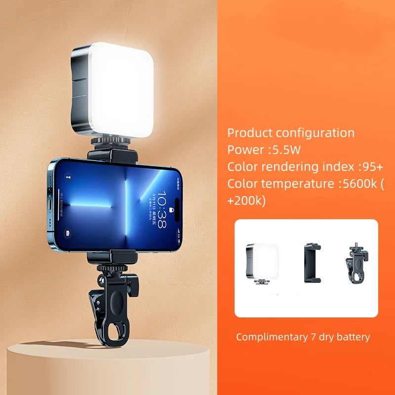 A blue smartphone is illuminated by a mini clip-on LED fill light, showing product configuration details.