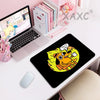 A black gaming mouse pad featuring a yellow dog with a fire background and the text This Is Fine