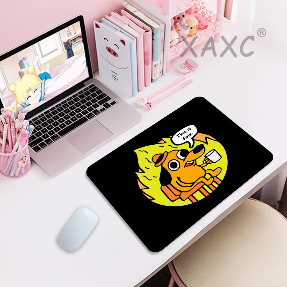 A black gaming mouse pad featuring a yellow dog with a fire background and the text This Is Fine