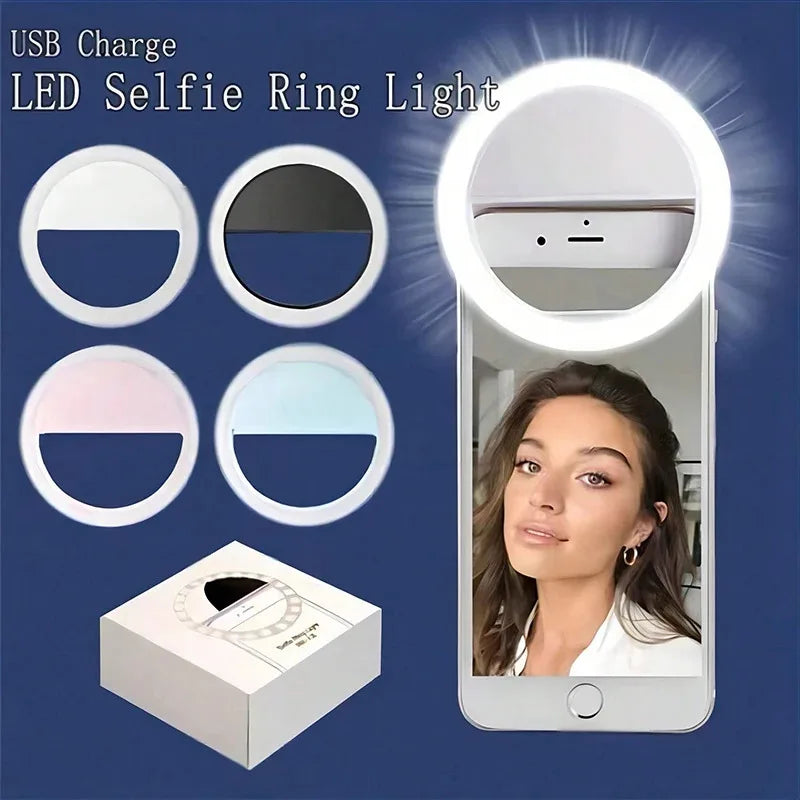 حلقة تصوير بإضاءة LED بيضاء بألوان متعددة، مع صندوق بجانب هاتف ذكي يعرض...