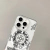 Clear acrylic phone case with a Chrome Hearts horseshoe and floral design featuring multiple camera lenses.