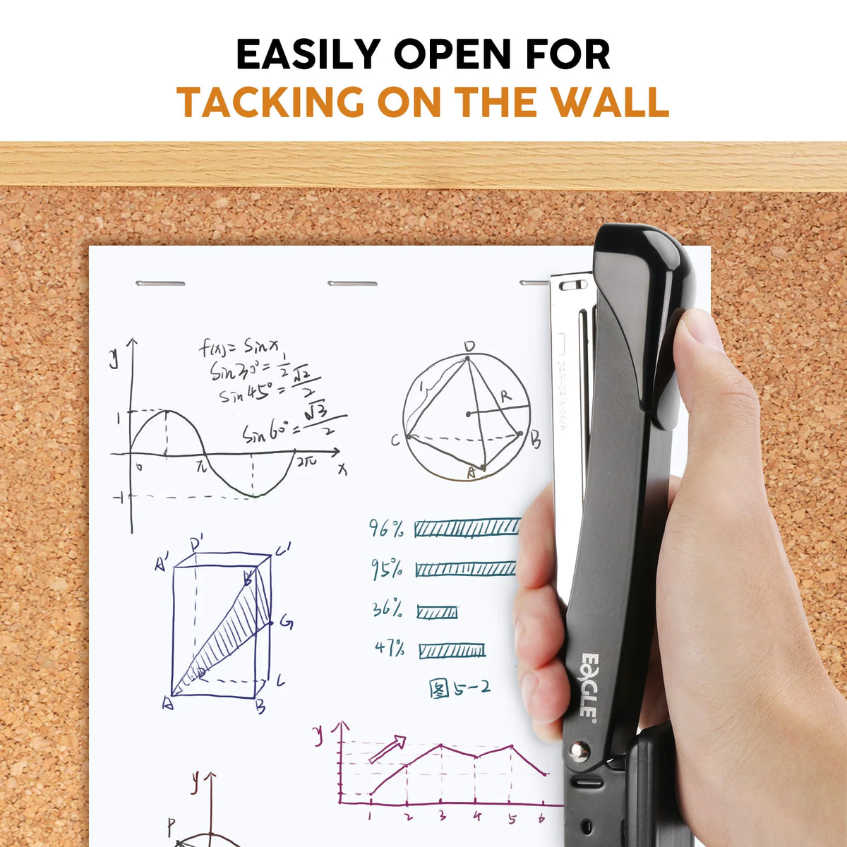 A hand is using a heavy-duty metal stapler to tack a piece of paper onto a wooden board.