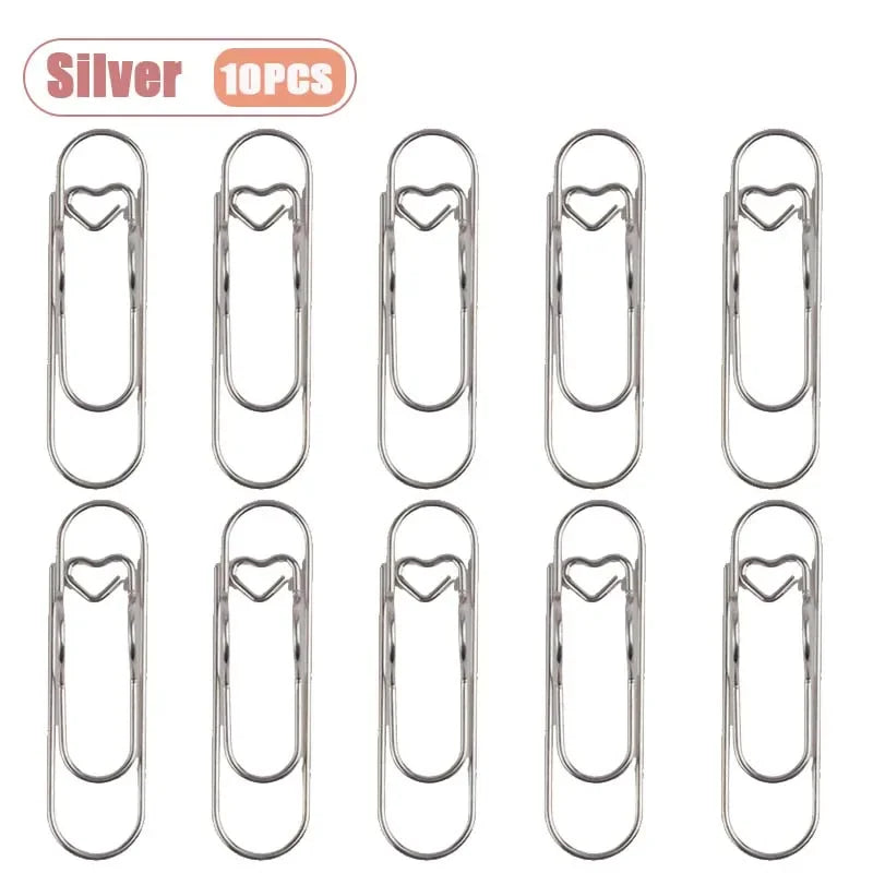 Silver metal pen clips for notebooks and journals shown in various styles