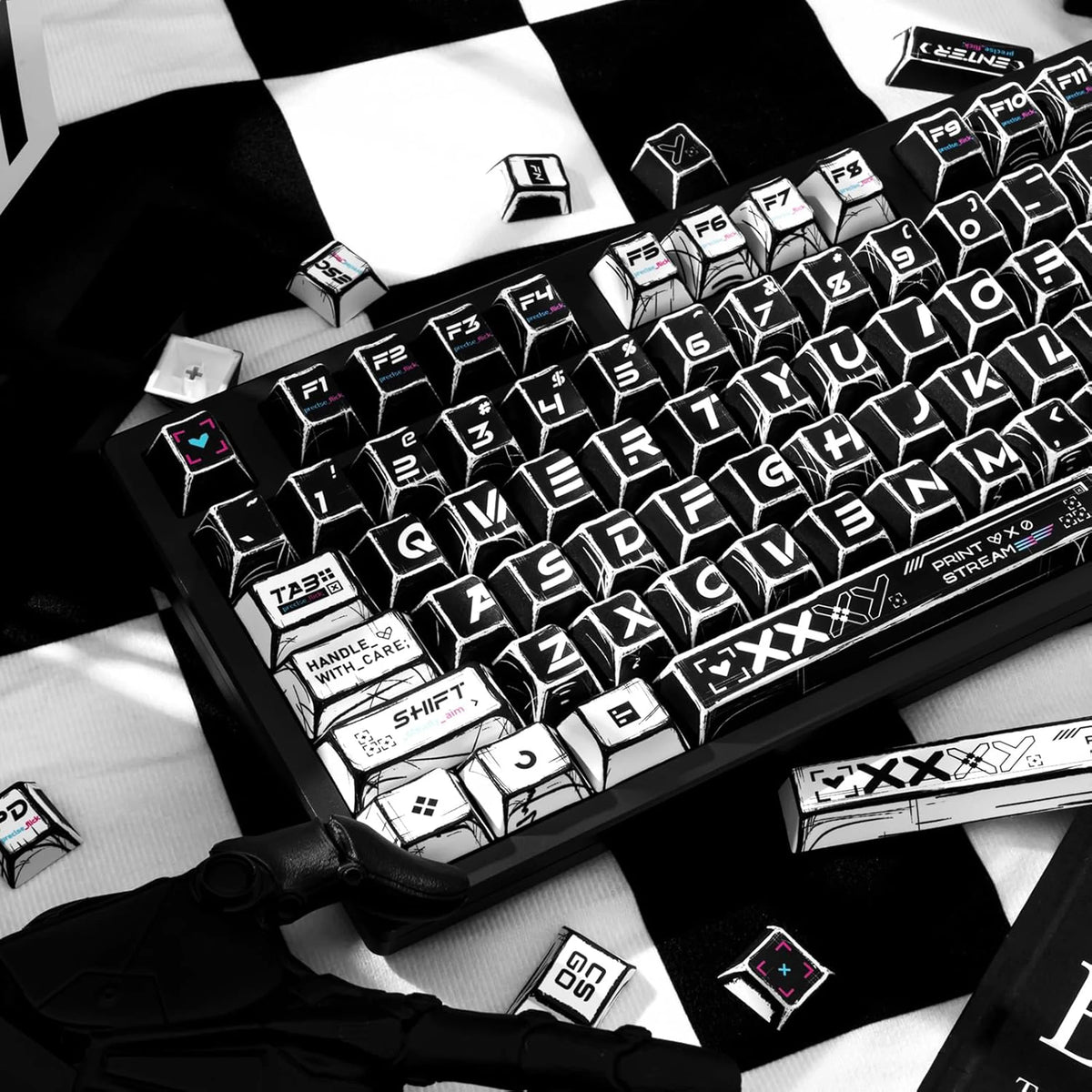 A close-up of a black and white comic-style PBT keycap set on a mechanical keyboard, viewed from above.