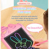 A child draws a colorful outline of a rabbit on a pink LCD drawing tablet for creative activity.