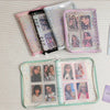 A collection of transparent zipper photo binders in pink and clear plastic, featuring various sized cards and keepsakes.