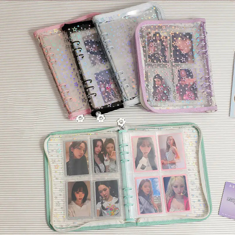 A collection of transparent zipper photo binders in pink and clear plastic, featuring various sized cards and keepsakes.
