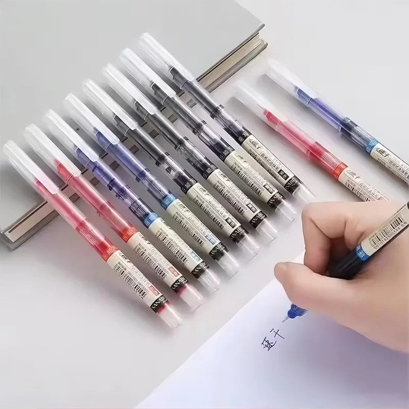 A hand holds a row of fine point pens with various colored tips, demonstrating quick-dry writing tools.