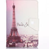 A pink and white leather folio case featuring a silhouette of the Eiffel Tower against a cityscape background.