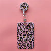 A pink leopard print card holder clip with a clear plastic cover and attached keyring.