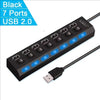 A black 7-port USB 2.0 hub splitter with a cable connected to the end.