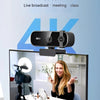 A 4K HD webcam is mounted on a monitor, showing a smiling woman, with text promoting live broadcast and meetings.