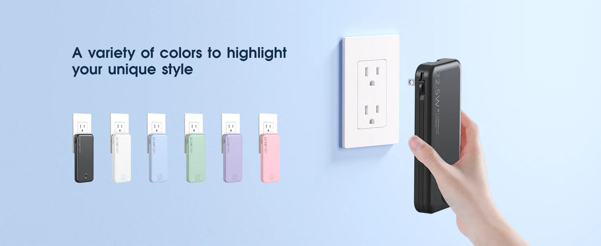 A hand holds a black portable charger next to a display showing various colored versions.