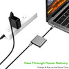 A silver USB-C to HDMI docking adapter is shown connecting a laptop to a power source for pass-through power delivery.