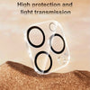 Clear dual camera lens protectors for an iPhone screen resting on a textured brown surface.