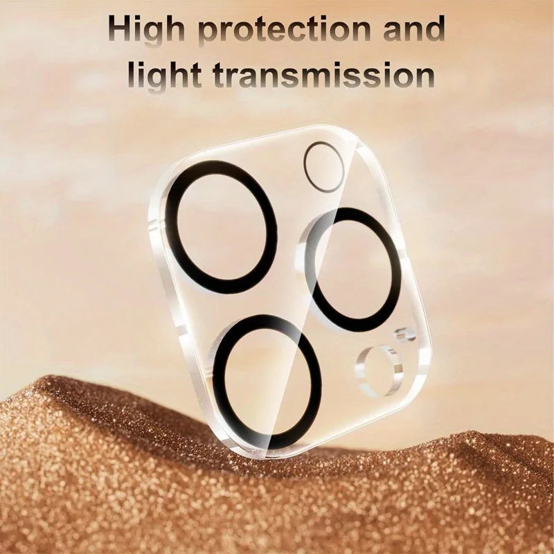 Clear dual camera lens protectors for an iPhone screen resting on a textured brown surface.