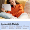 A woman is relaxing on a sofa using a magnetic wireless charging module to charge an iPad.