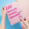 A pink marble budget binder is shown being held by a hand, featuring the text 100 Envelope Savings Challenge.