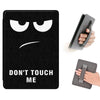 A black leather case with a distressed face emoji design and a matching protective cover for an electronic device.