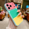 A hand holds a Dopamine multicolor block acrylic phone case for iPhone featuring pink, teal, and yellow sections.