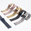 A collection of various colored Milanese loop watch bands in stainless steel mesh, including gold, rose gold, and black.