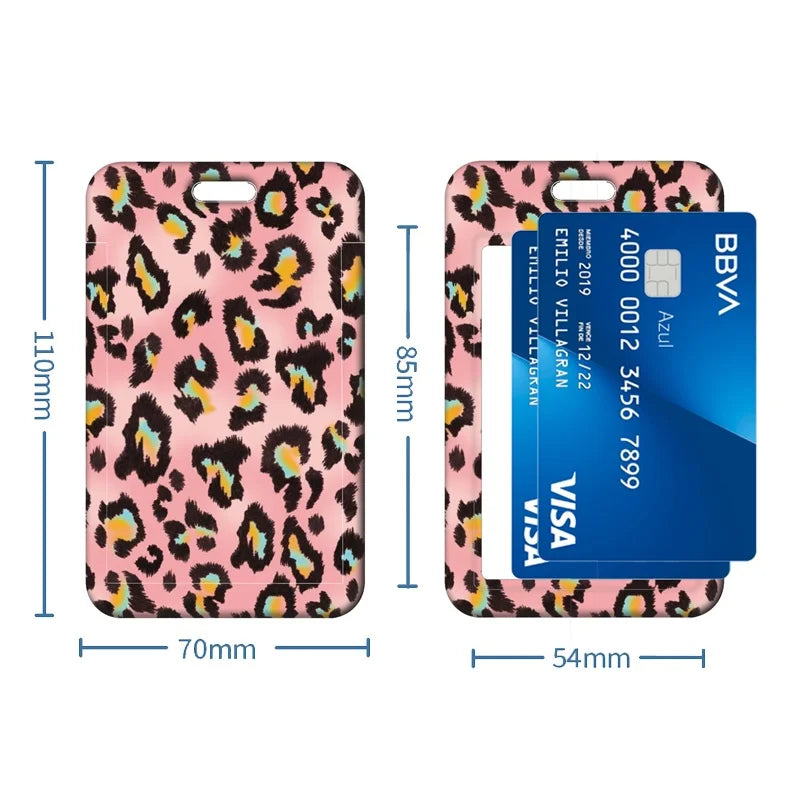 A pink leopard print retractable badge holder with a blue card inside.