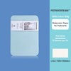 A tin of 100% cotton watercolor paper for postcards with a light blue cover and white label.