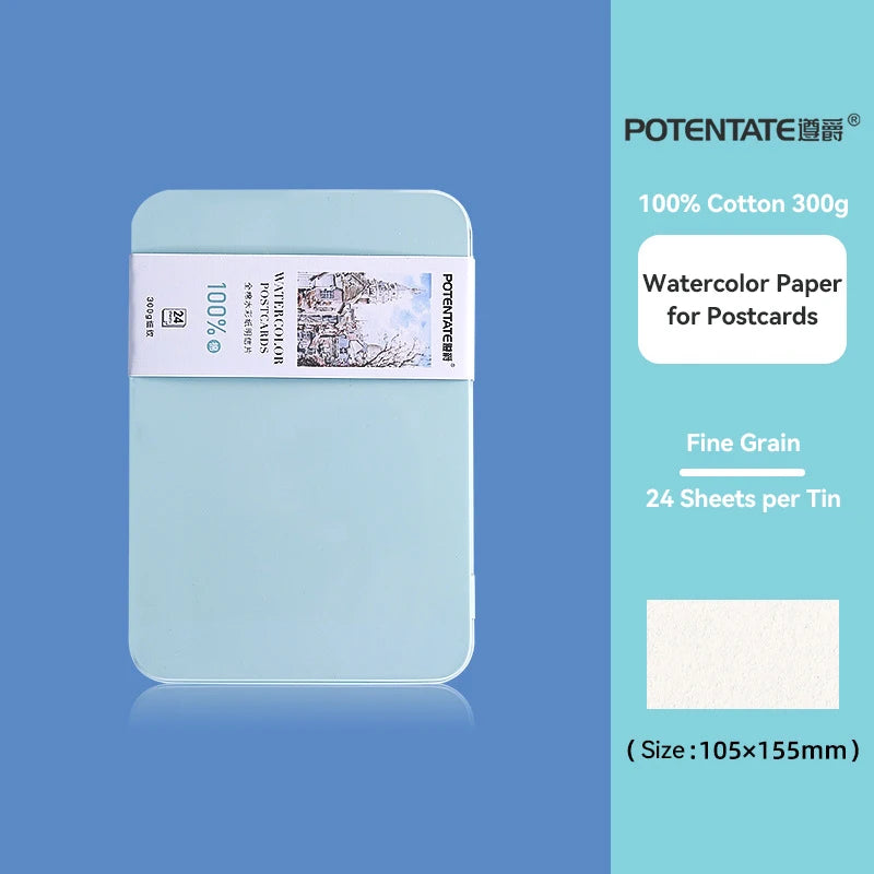 A tin of 100% cotton watercolor paper for postcards with a light blue cover and white label.
