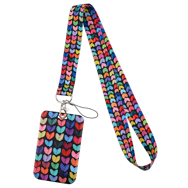 A colorful, patterned fabric lanyard with a metal clip and a tag attached.