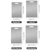 A set of three stainless steel double-sided cutting boards in various sizes and finishes.