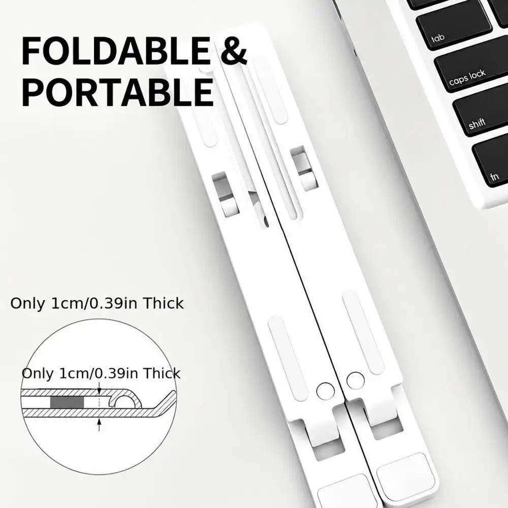 A white foldable and portable laptop cooling stand shown next to a laptop keyboard.