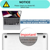 A close-up of a silver MacBook, showing a notice about checking the model number before ordering.